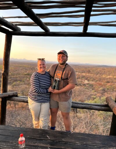 Barend and Anri on a sunset game viewing platform